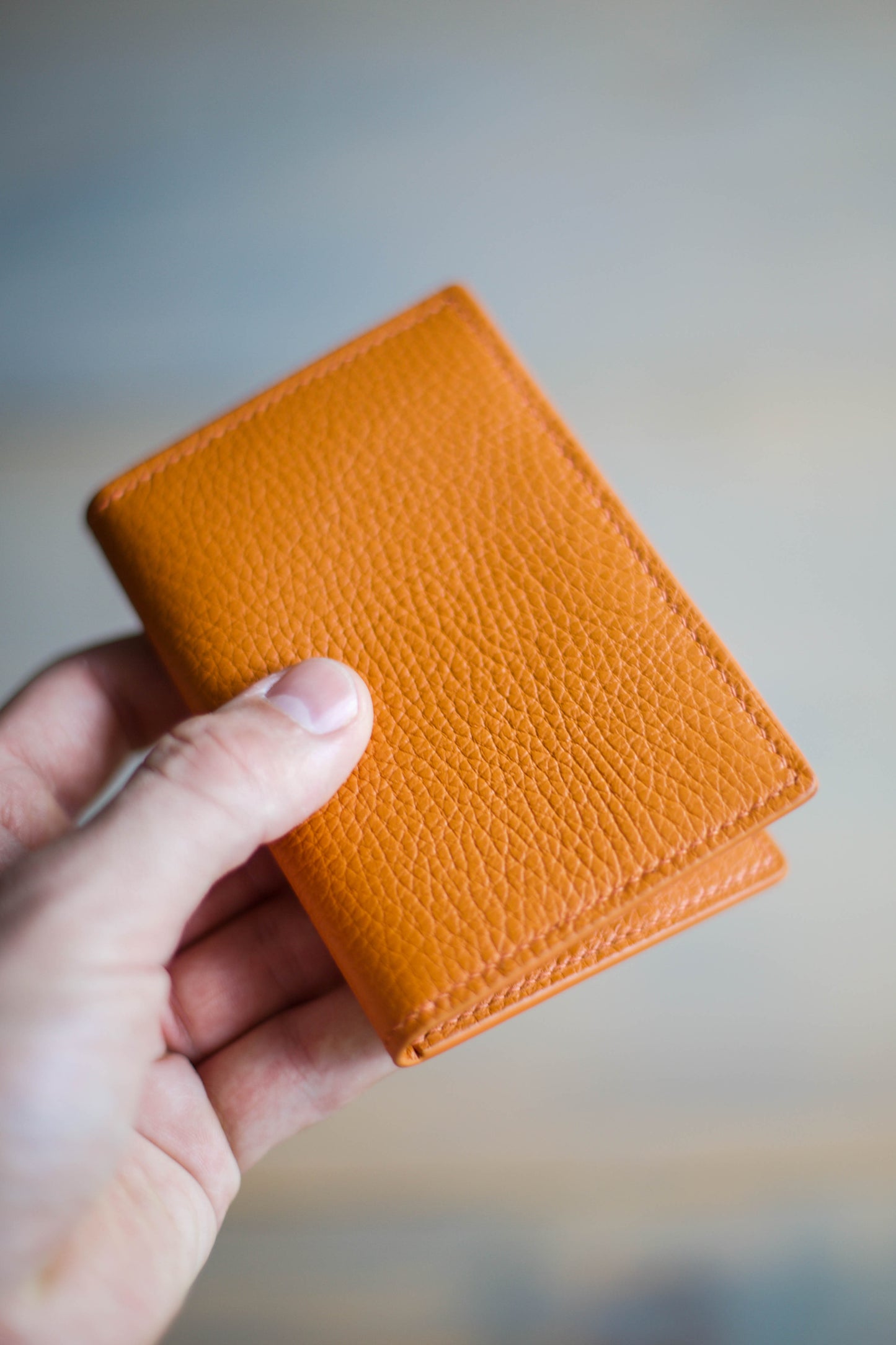 6 SLOT BIFOLD (orange pebbled leather)