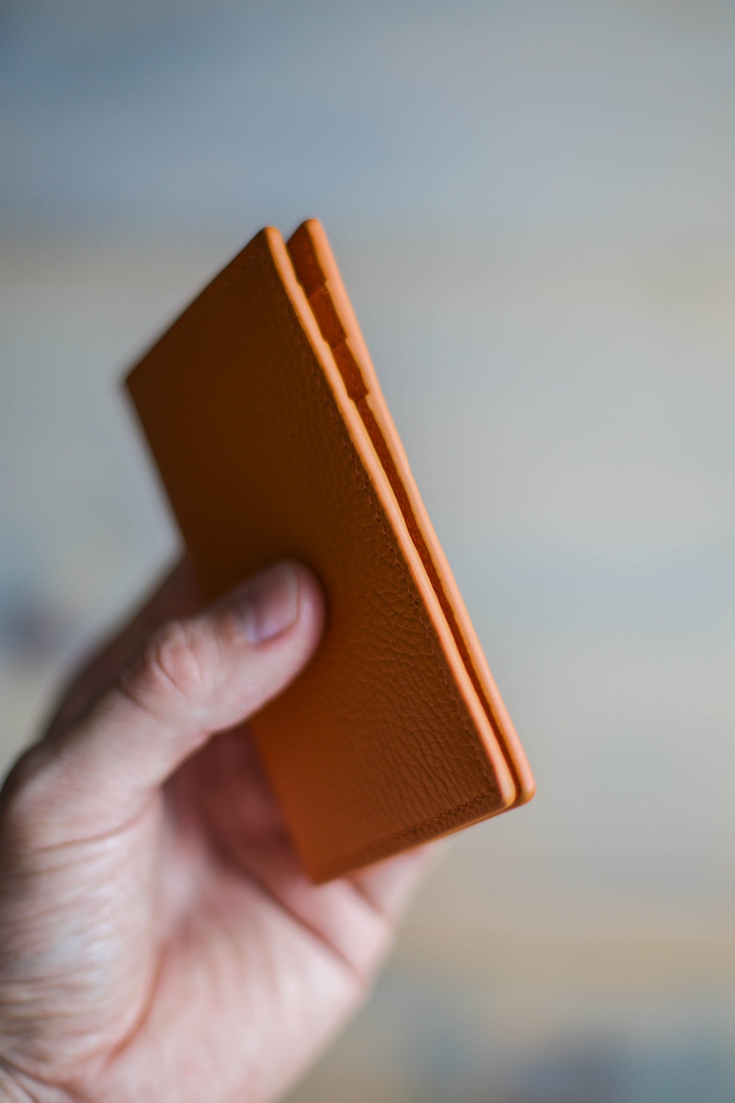 6 SLOT BIFOLD (orange pebbled leather)