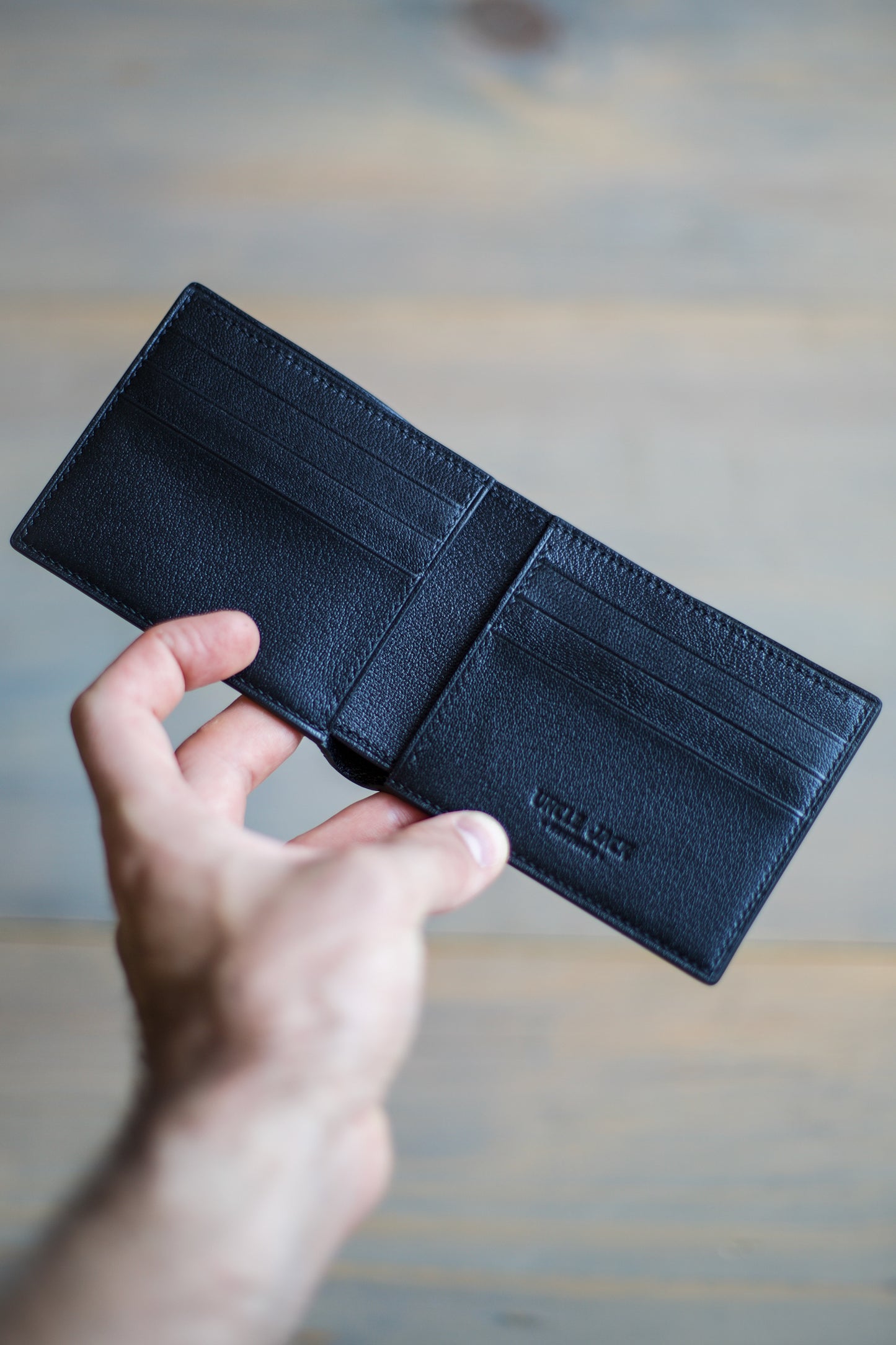 6 SLOT BIFOLD (black goat/ green stingray leather)