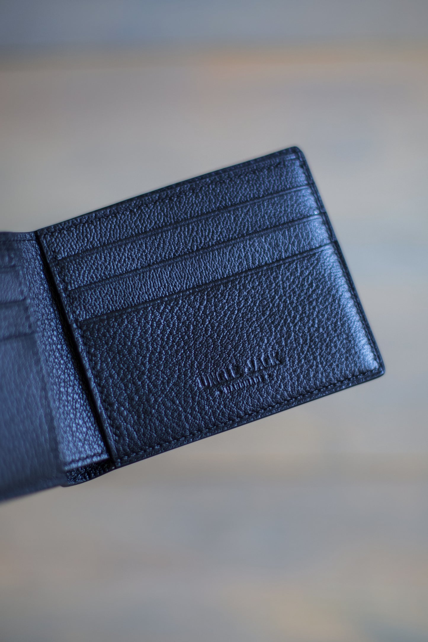 6 SLOT BIFOLD (black goat/ black ostrich leg leather)